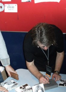 Gary at the Merch. stall  - Photo by Mat Mckenzie